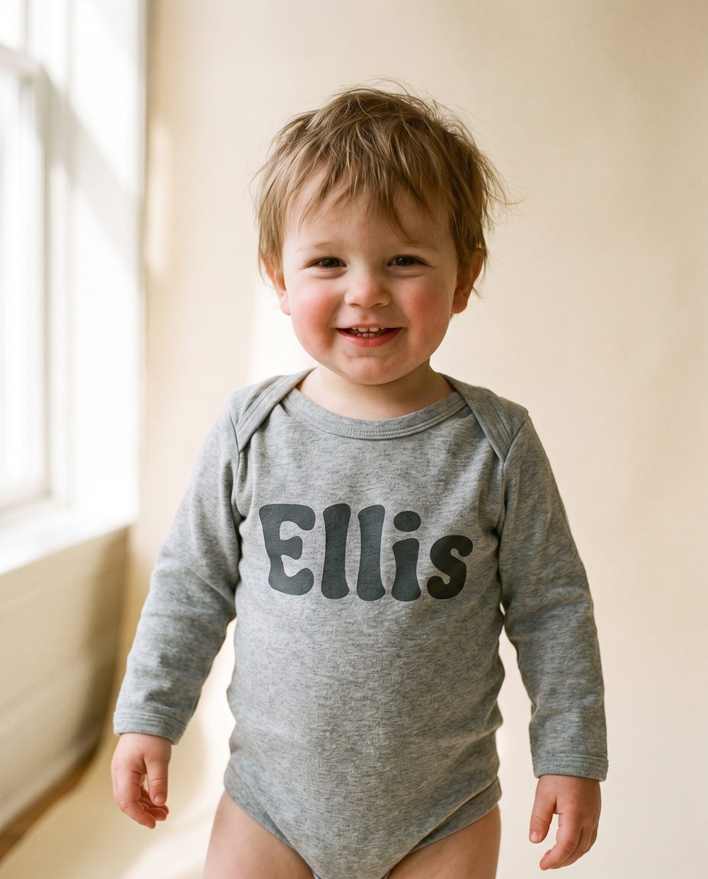 “Ellis” on a Heather-grey bodysuit